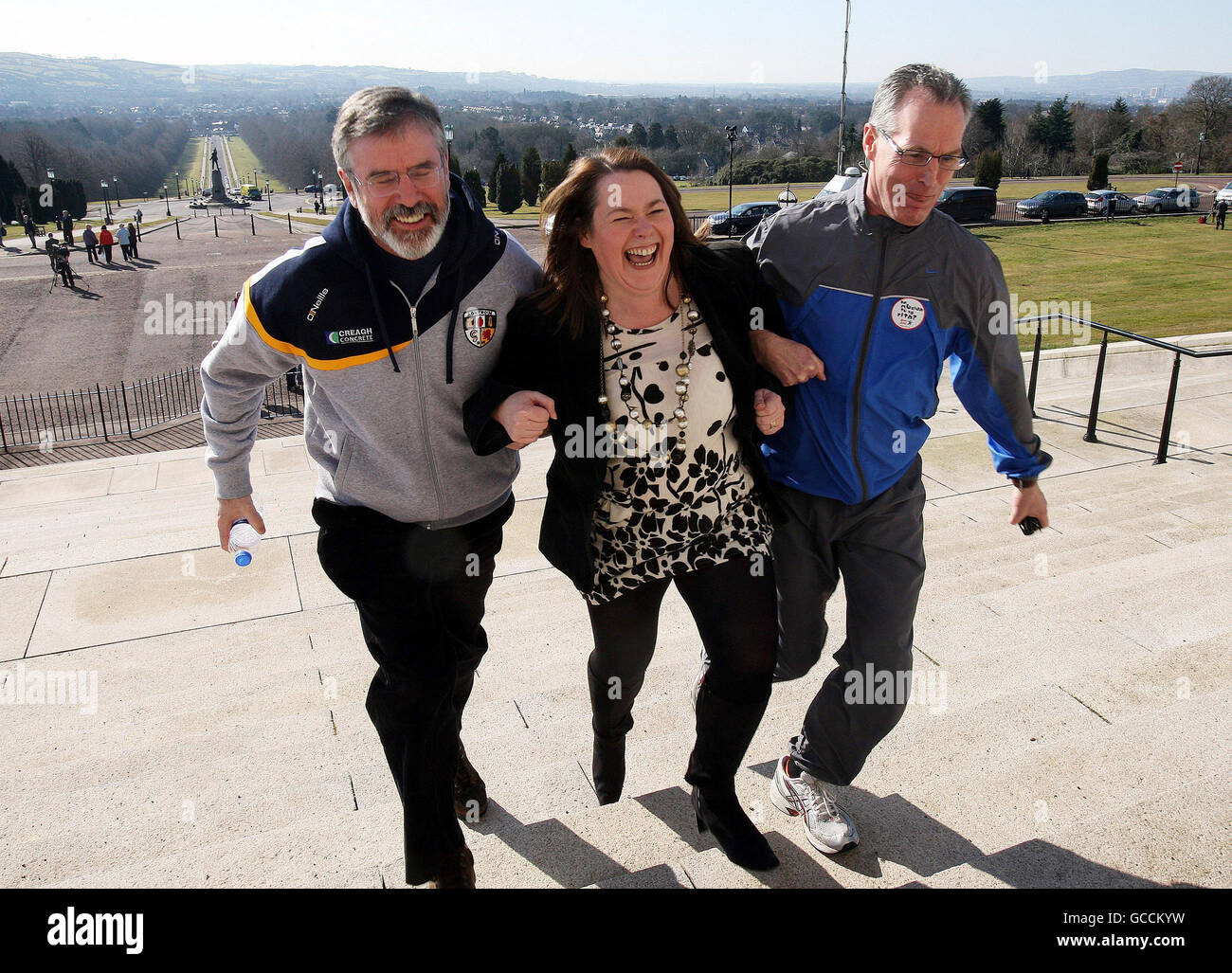 Sinn Fein President Gerry Adams (left) with colleagues Michelle Gildernew and Gerry Kelly, at a fun run at Stormont, to promote the Irish language, during a break in the Policing and Justice debate. Stock Photo