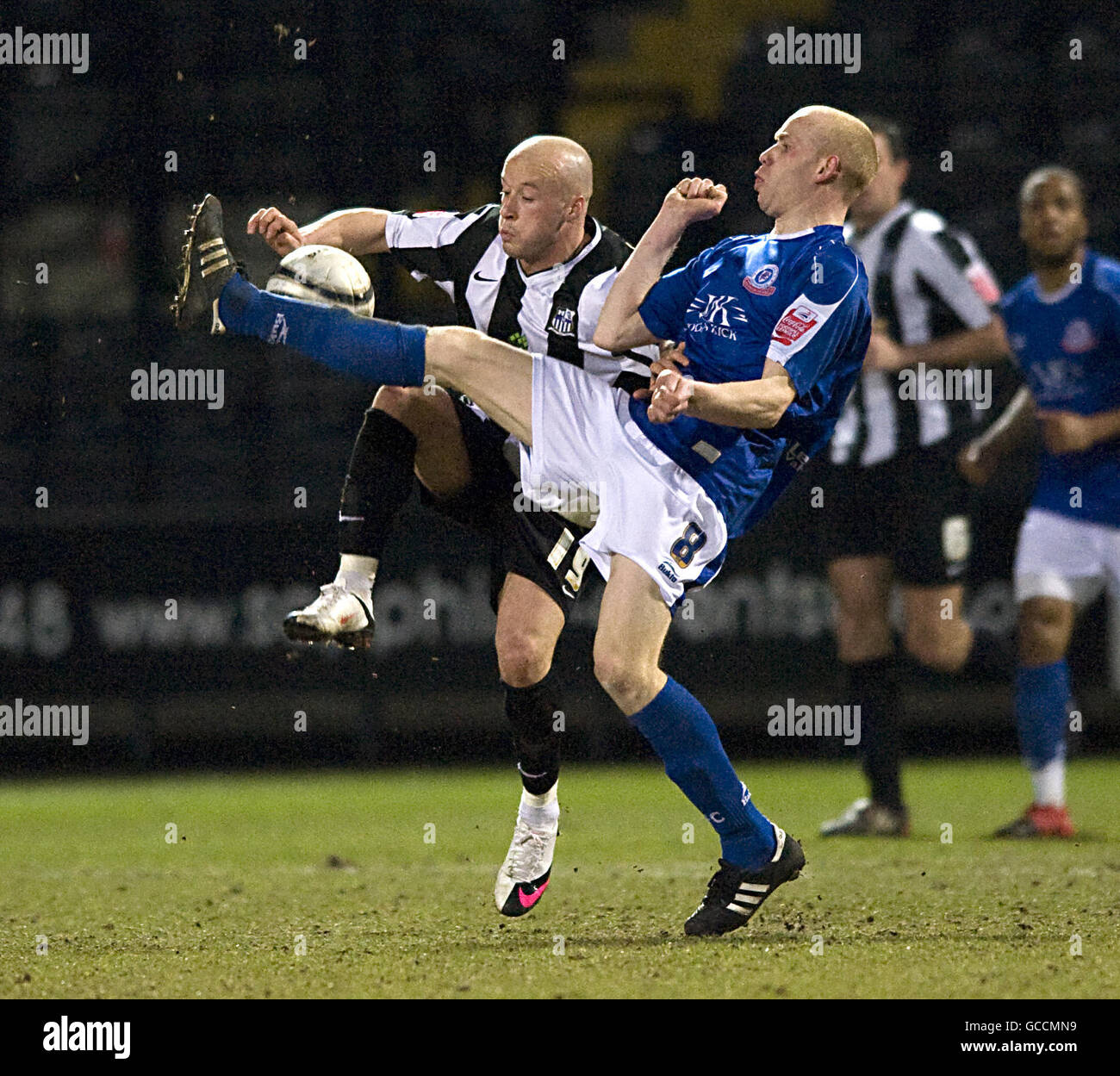 Soccer - Coca-Cola Football League Two - Notts County v Chesterfield - Meadow Lane. Notts County's Luke Rodgers and Chesterfield's Derek Niven battle for the ball Stock Photo