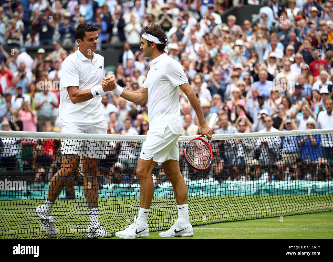 Raonic federer wimbledon hi-res stock photography and images - Alamy