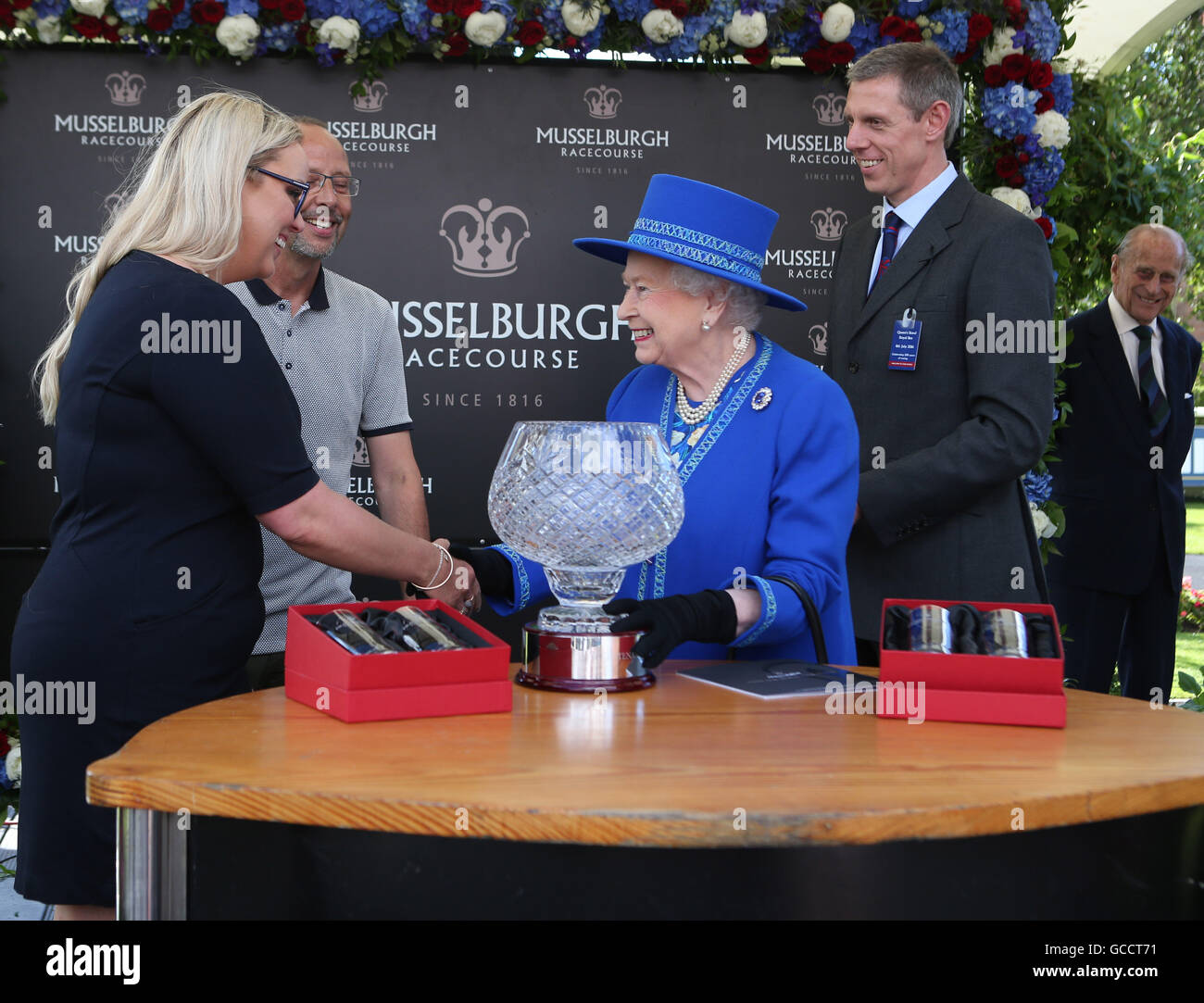 Queen Elizabeth II presents the Musselburgh BiCentenary Cup to the