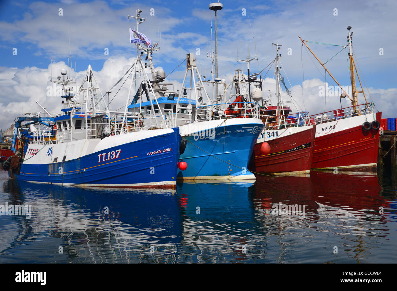 Four Fishing Boats Moored in Mallaig Harbour in the Northwest Highlands, Scotland UK Stock Photo