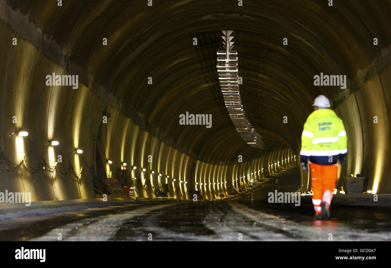Highways Agency project manager Paul Arnold walks through the southbound tunnel of the new A3 at Hindhead in Surrey where engineers are close to completing a pair of road tunnels under the Devil's Punch Bowl. Stock Photo