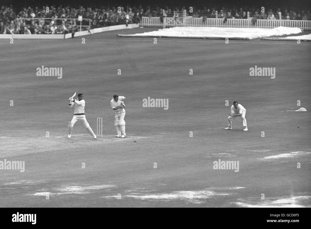 Cricket - International Test - England v West Indies - 4th Day - Lord's. Garfield Sobers, the West Indies captain, cuts a ball from Fred Titmus for 4. Stock Photo