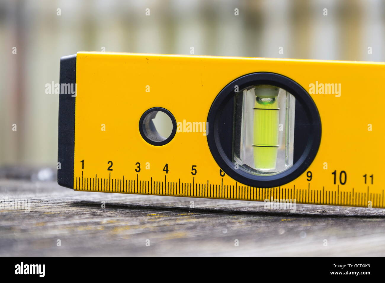 Bubble spirit water level construction tool on wooden board closeup Stock Photo Alamy