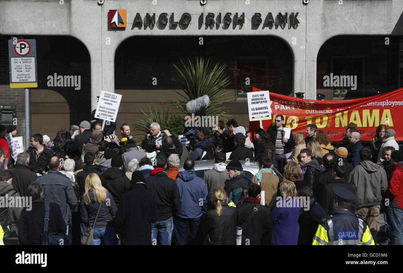 Members of the Socialist Party protest outside a branch in St Stephen's Square, Dublin of Anglo-Irish Bank after the troubled institution announced the biggest corporate losses in Irish history - 12.7 billion euro (11.3 billion). Stock Photo