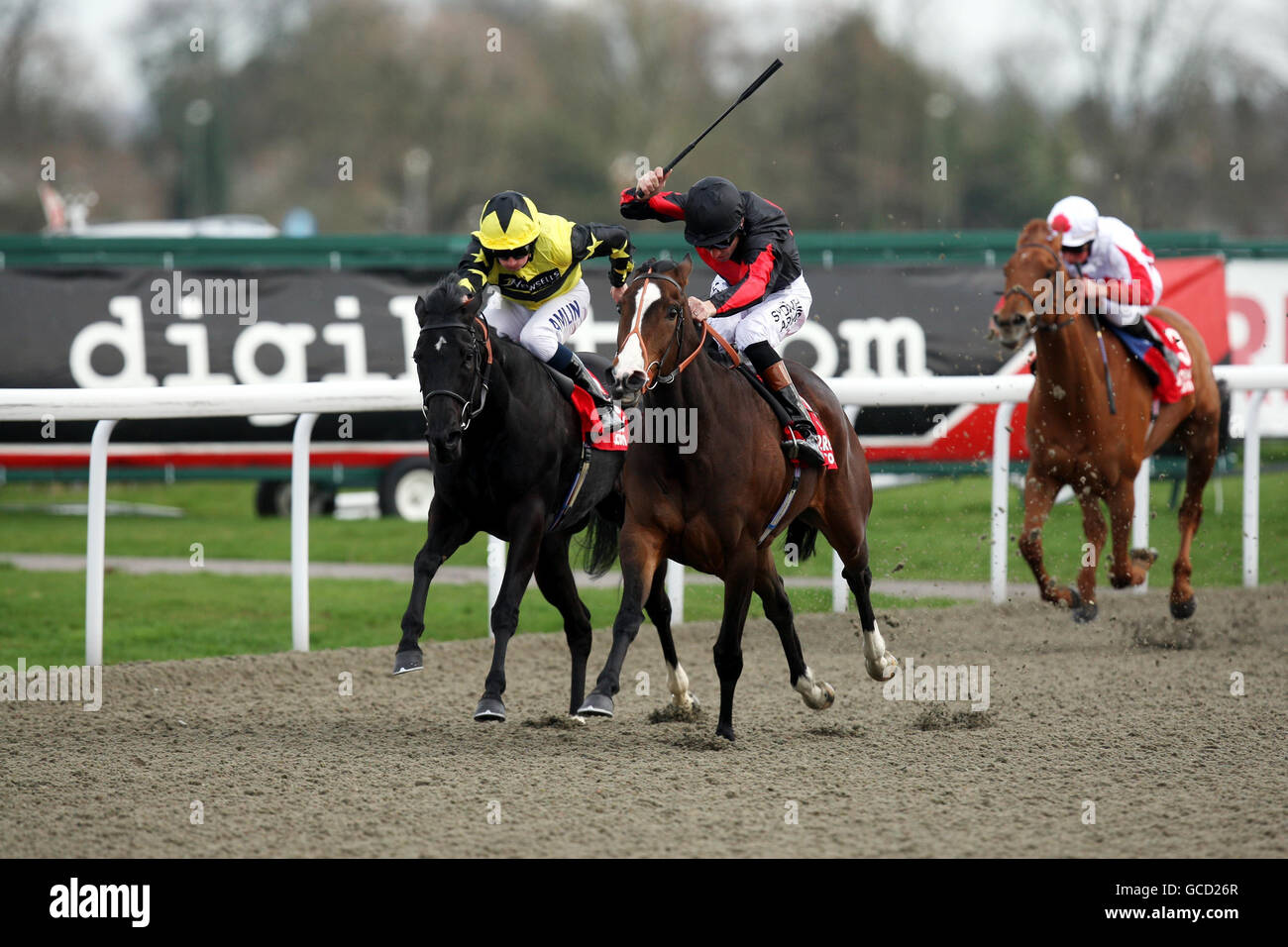 Shamwari Lodge ridden by Richard Hughes (black cap) wins the 32REd Casino Snowdrop Fillies' stakes during the Easter Saturday Race Day at Kempton Park Racecourse, Kempton. Stock Photo