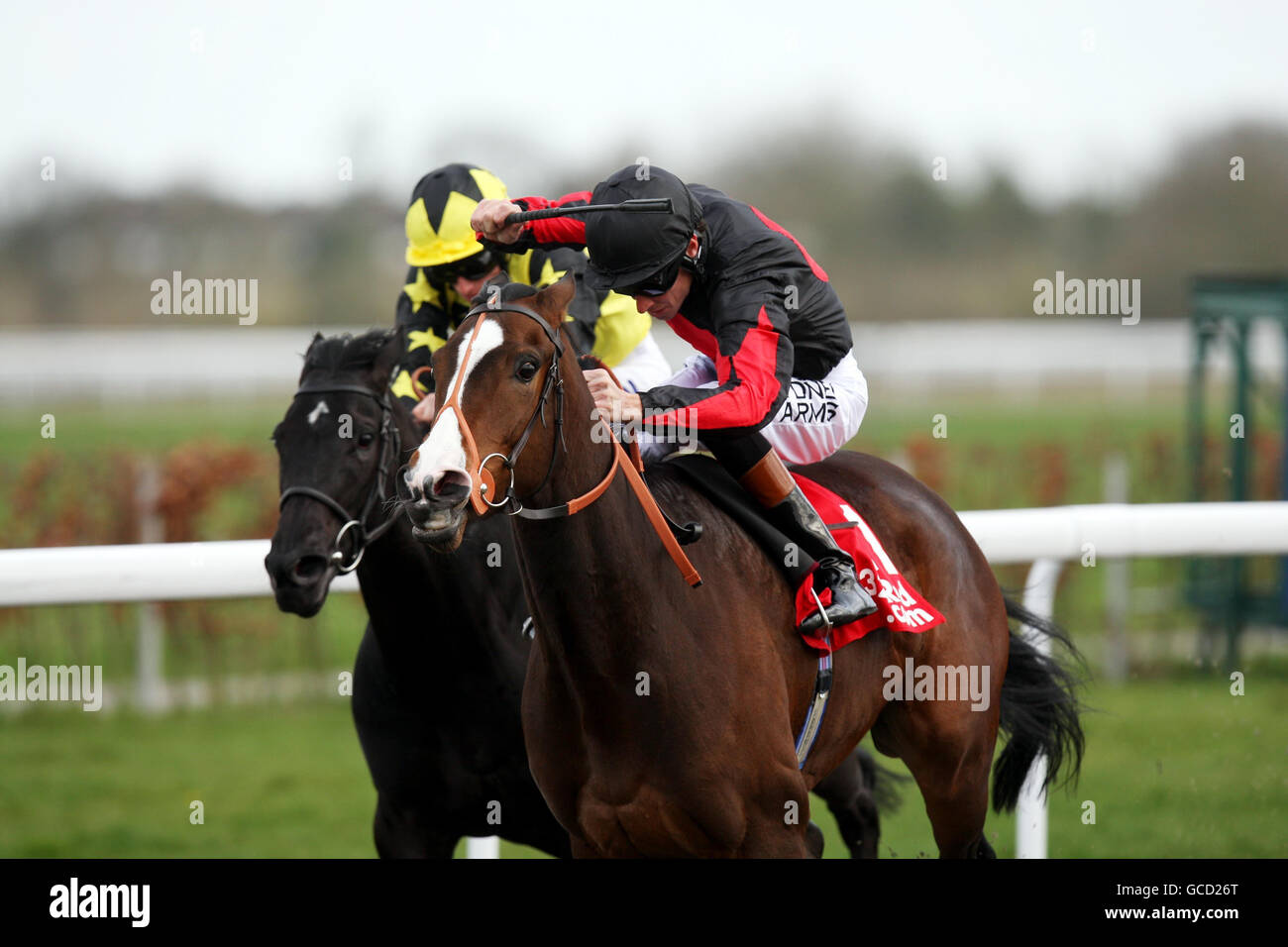 Shamwari Lodge ridden by Richard Hughes (right) wins the 32REd Casino Snowdrop Fillies' stakes during the Easter Saturday Race Day at Kempton Park Racecourse, Kempton. Stock Photo