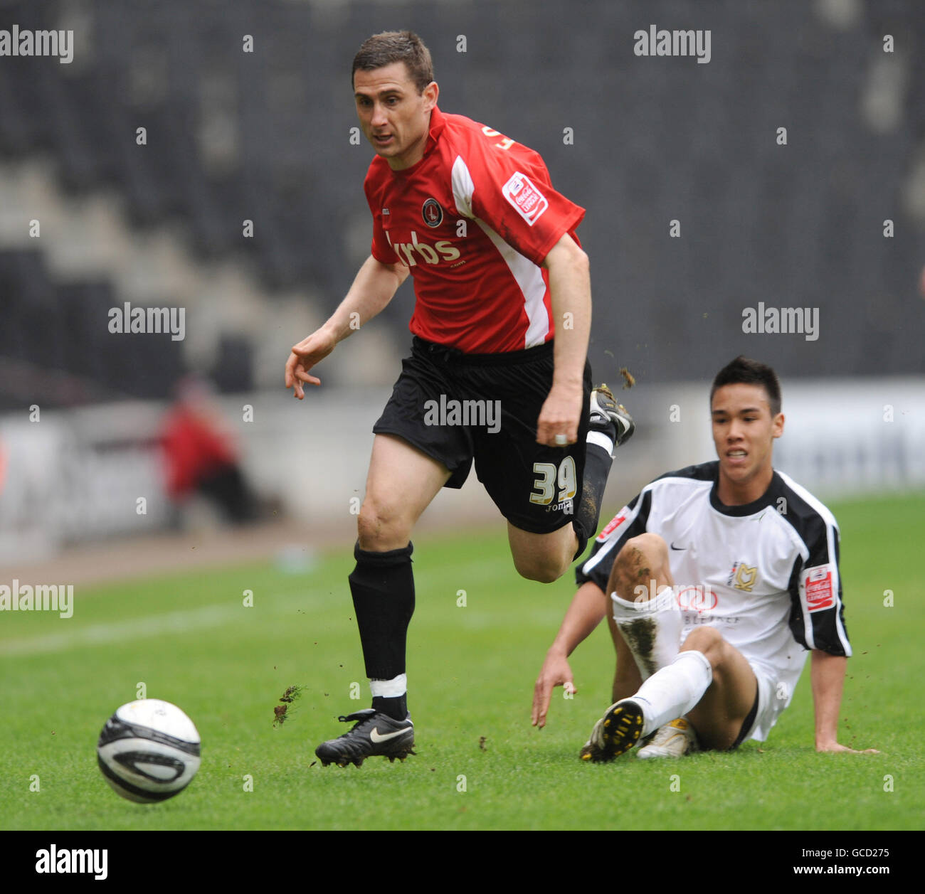 Milton Keynes Dons' Adam Chicksen and Charlton Athletic's Nicky Forster