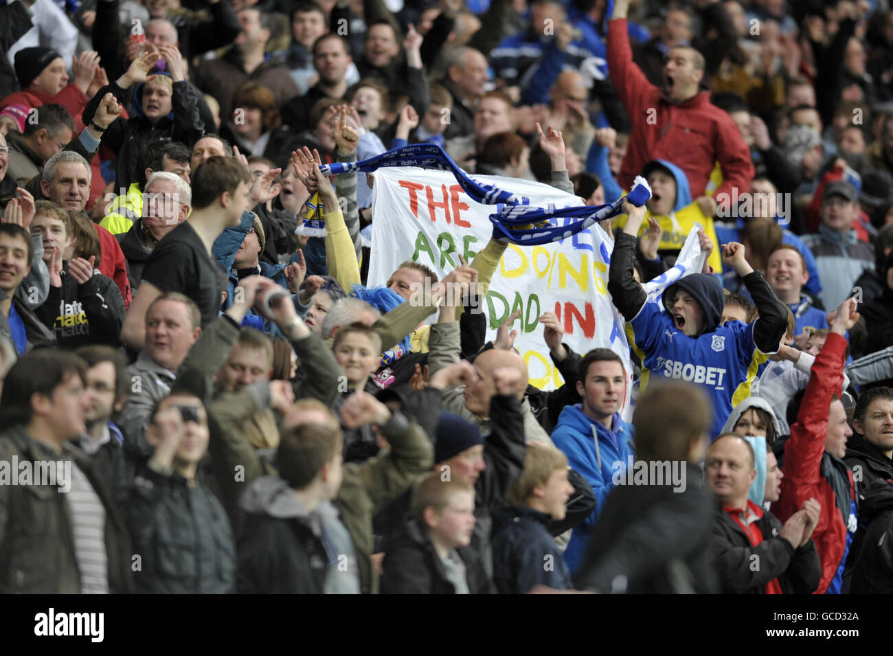 Cardiff fans cheer towards the Swansea fans after Michael Chopra scored his second goal during the Coca-Cola Championship match at Cardiff City Stadium, Cardiff. Stock Photo