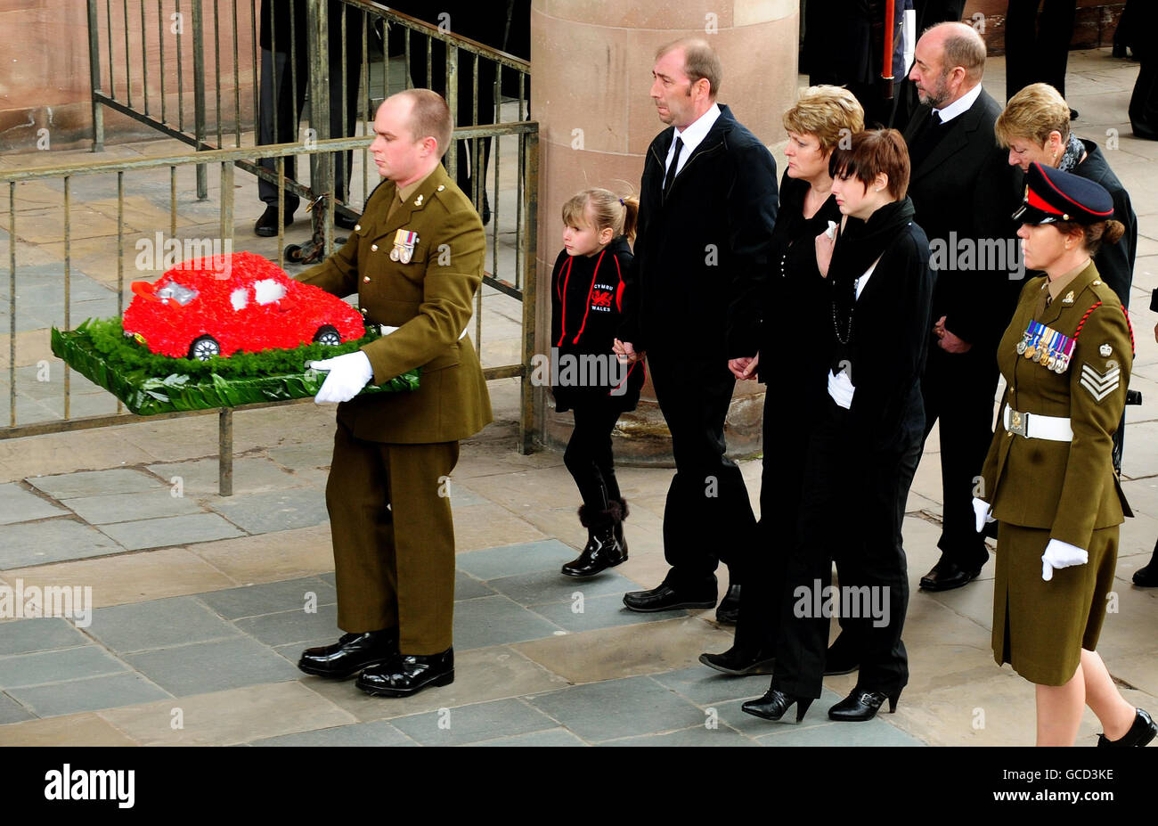 Family members, of Sapper Guy Mellors, 20, from 36 Engineer Regiment, killed while clearing bombs in the north east of Sangin district, Helmand, Afghanistan, last month, (left to right) sister Kia ,8, step father Bill Holland, his mother Linda Holland and his sister Lana, 14, arrive for his funeral service at Coventry Cathedral. Stock Photo