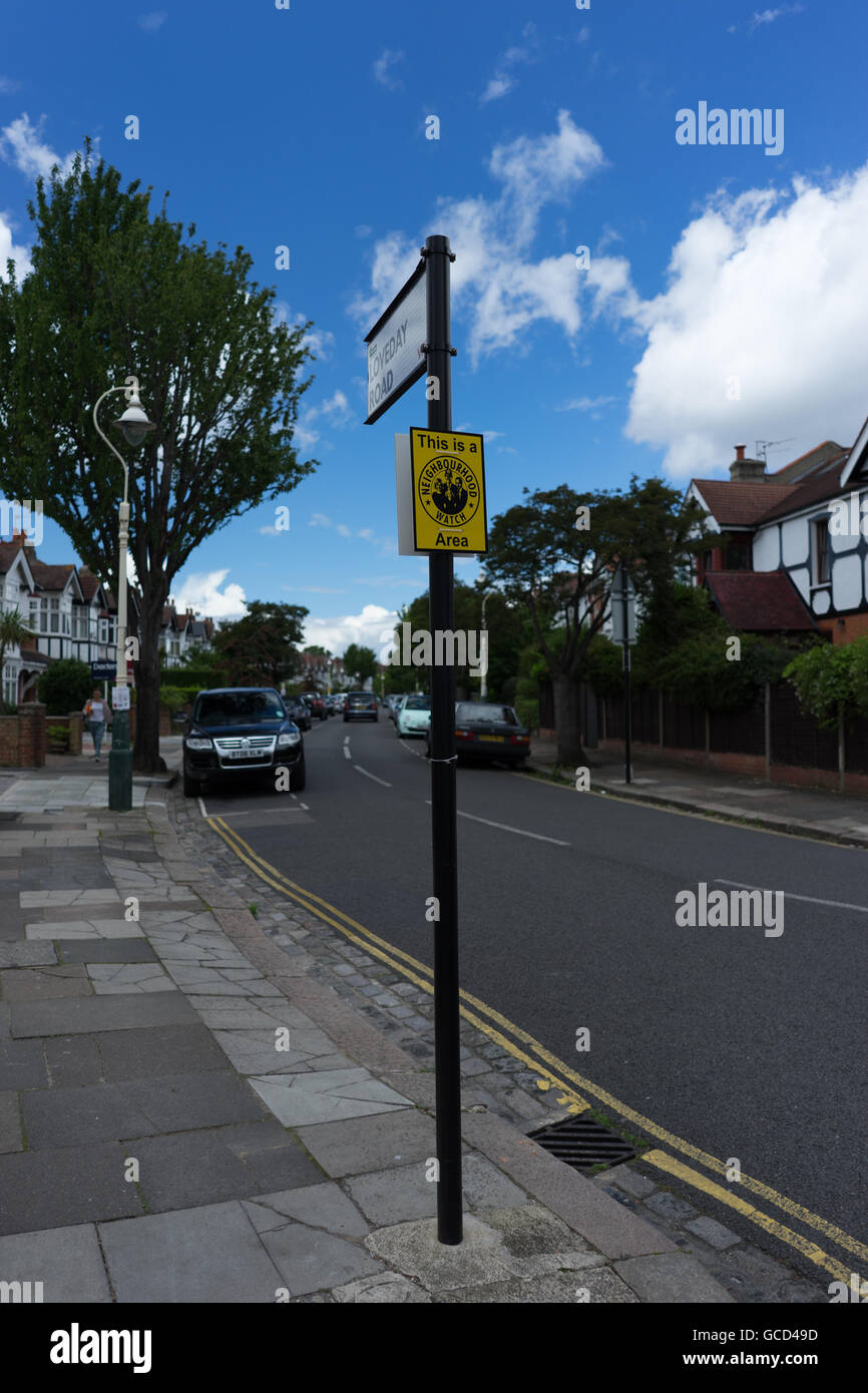 Neighborhood watch sign on street corner in England Stock Photo