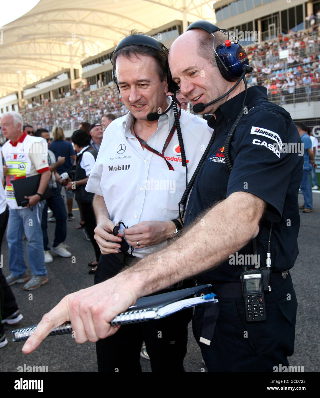 McLaren managing director Jonathan Neale (left) and chief technical officer of the Red Bull Adrian Newey during the Gulf Air Bahrain Grand Prix at the Bahrain International Circuit in Sakhir, Bahrain Stock Photo