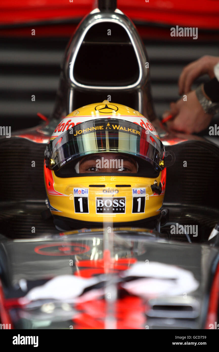 McLaren's Lewis Hamilton in his car prior to the Gulf Air Bahrain Grand Prix at the Bahrain International Circuit in Sakhir, Bahrain Stock Photo