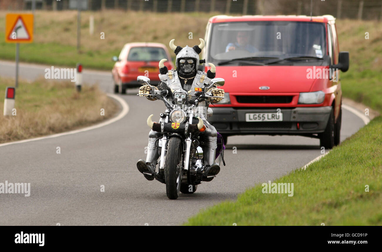 Mark Slater, aka ' Viker Biker', from Peterborough, Cambridgeshire, rides his Yamaha DragStar XVS 1100, through Whittlesey in Cambridgeshire. Stock Photo