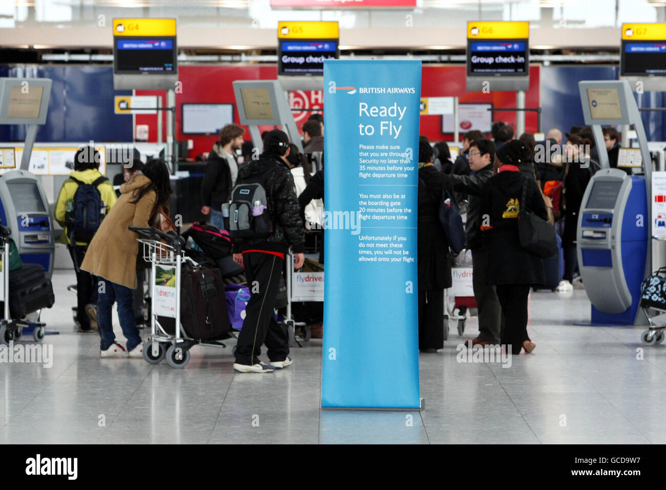 Passengers check in at Terminal 5 of Heathrow Airport in Middlesex, as ...