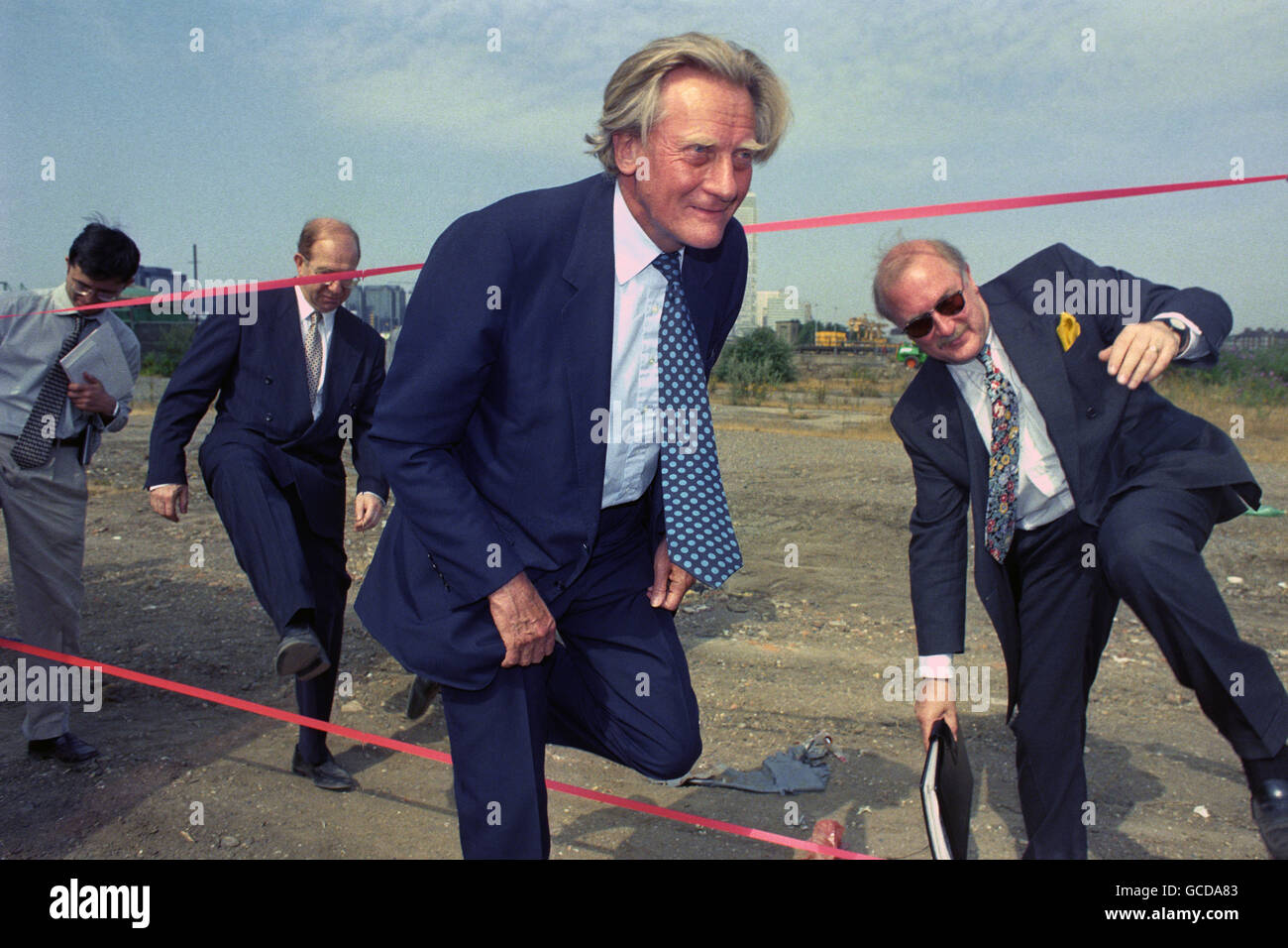 Deputy Prime Minister Michael Heseltine (centre) arrives at the site of the Millennium Exhibition, which forms the northern part of the 300-acre former gasworks on the East Greenwich peninsula, as British Gas starts work to prepare the site. Stock Photo