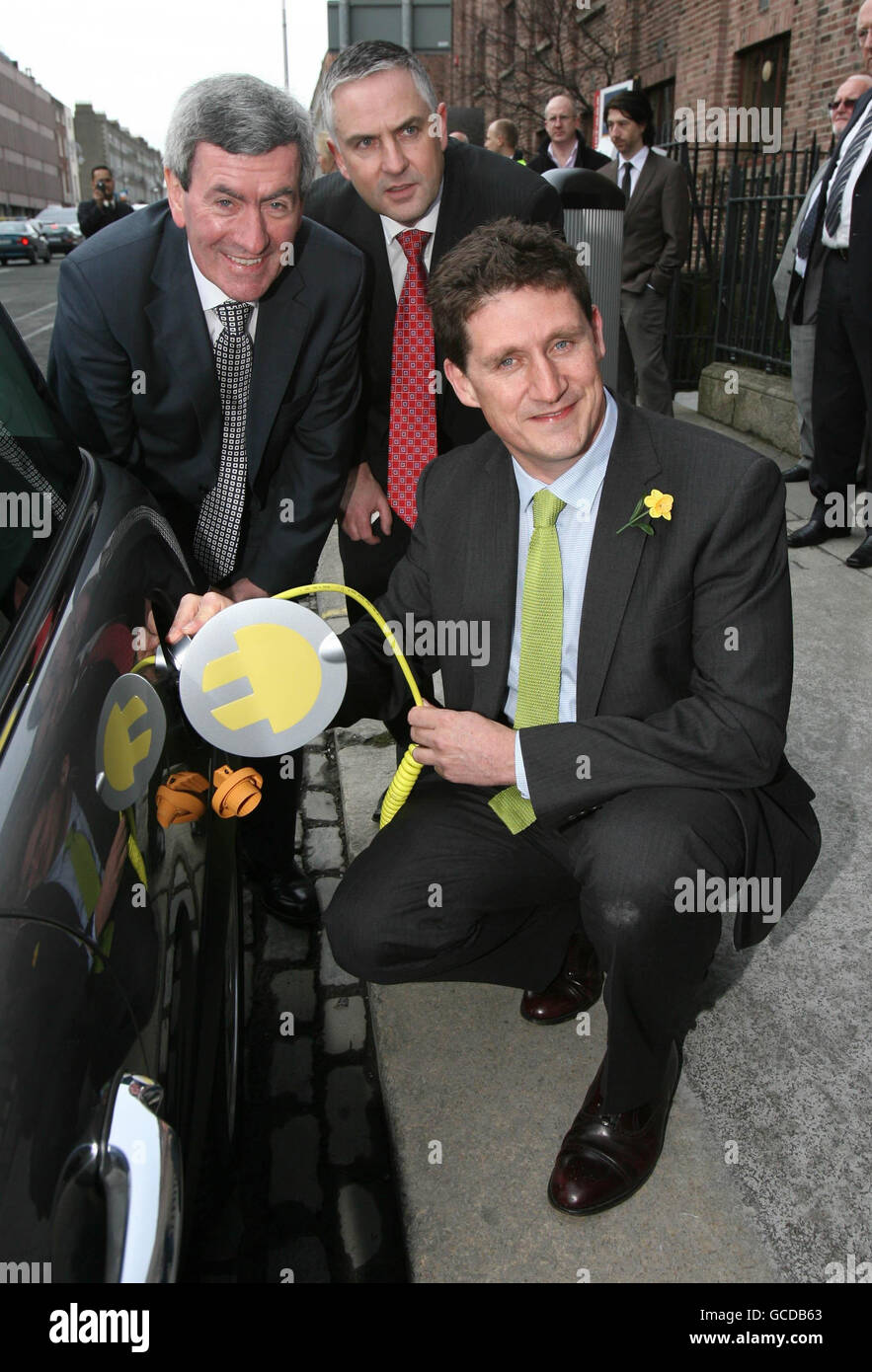 The first electric vehicle charge points in Ireland are officially launched by (left to right) ESB chief executive Padraig McManus, Paul Mulvaney, Managing Director, ESB Electric Vehicles and Minister for Communications, Energy and Natural Resources Eamon Ryan (front) in Dublin. Stock Photo