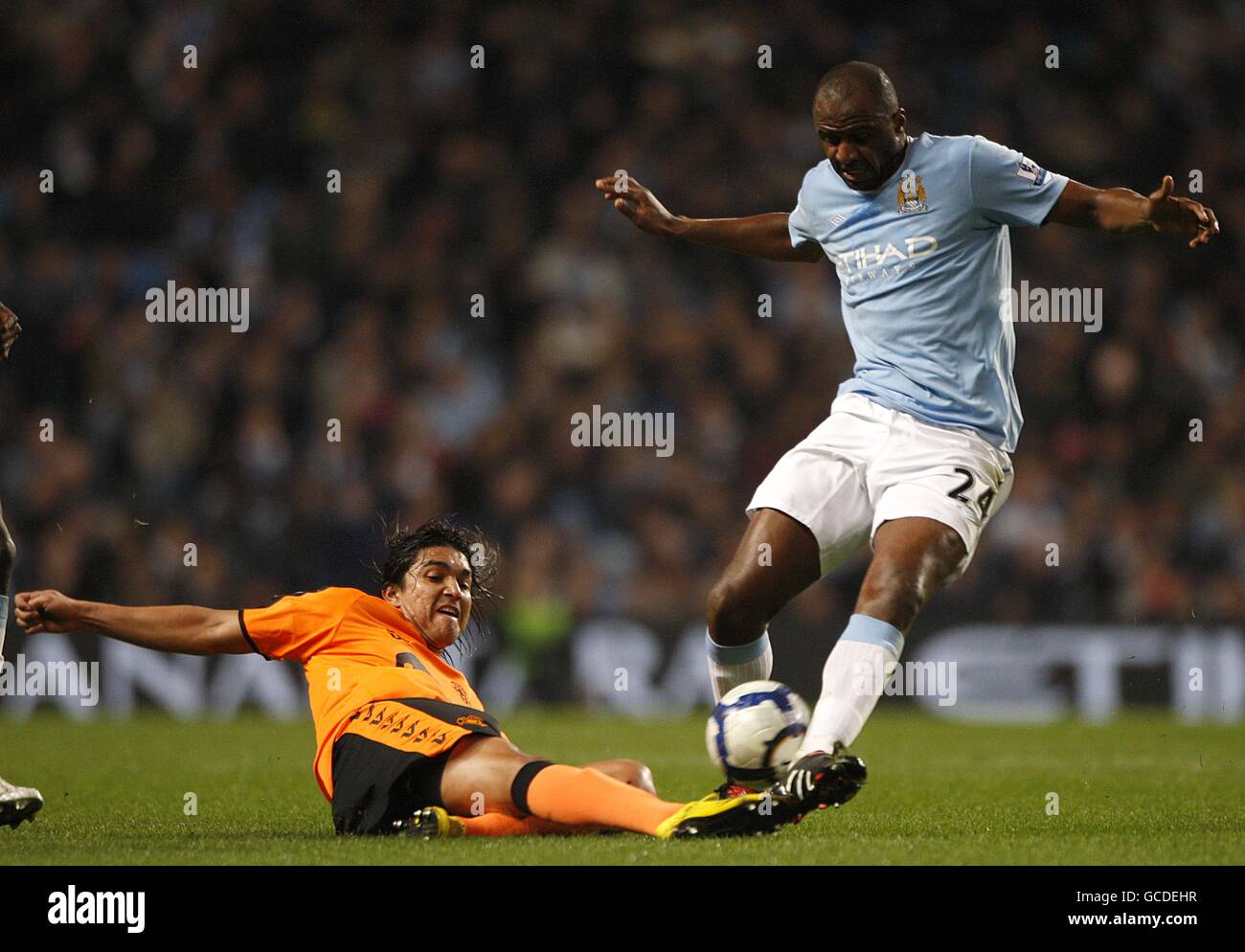 Wigan Athletic's Marcelo Moreno (left) and Manchester City's Patrick Vieira (right) battle for the ball Stock Photo