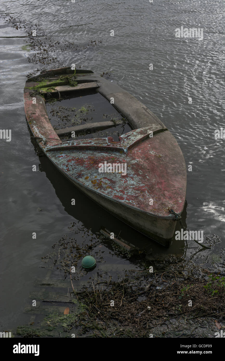 Sinking ship / failing business concept, represented by waterlogged