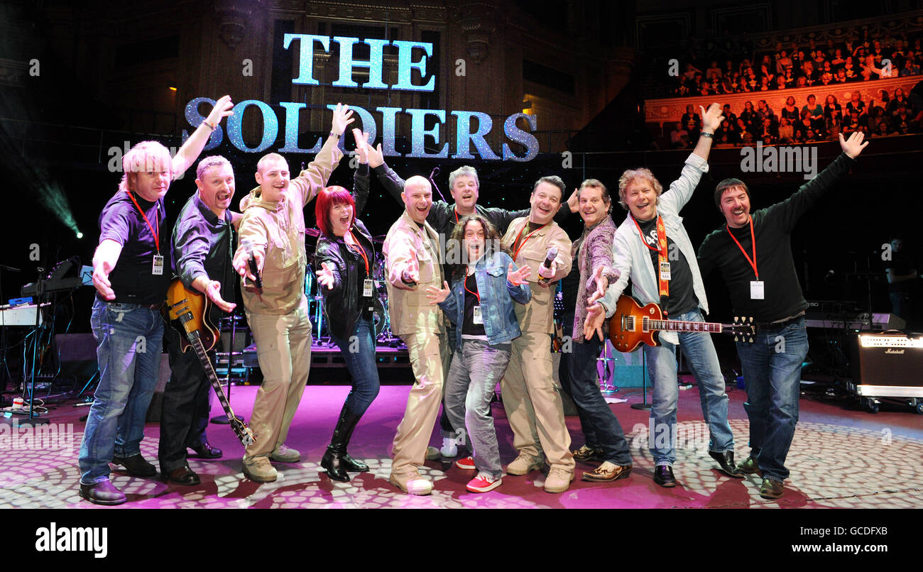 Lance Corporal Ryan Idzi (3rd left), Sergeant Major Gary Chilton (5th left) and Sergeant Richie Maddocks (4th right) at rehearsals with their band at the Royal Albert Hall during their Coming Home Tour. The Soldiers reached number four in the UK album chart with their debut release Coming Home, in October last year, selling 600,000 copies and are joined by the two US soldiers. Scarlett from Atlanta and Basnight from Georgia, both sergeants in the US Army, asked to sing alongside The Soldiers in a 'personal show of solidarity' for fellow soldiers worldwide. PRESS ASSOCIATION Photo. Picture Stock Photo