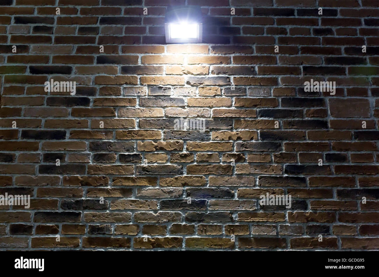 rough red brick wall texture with a spotlight Stock Photo