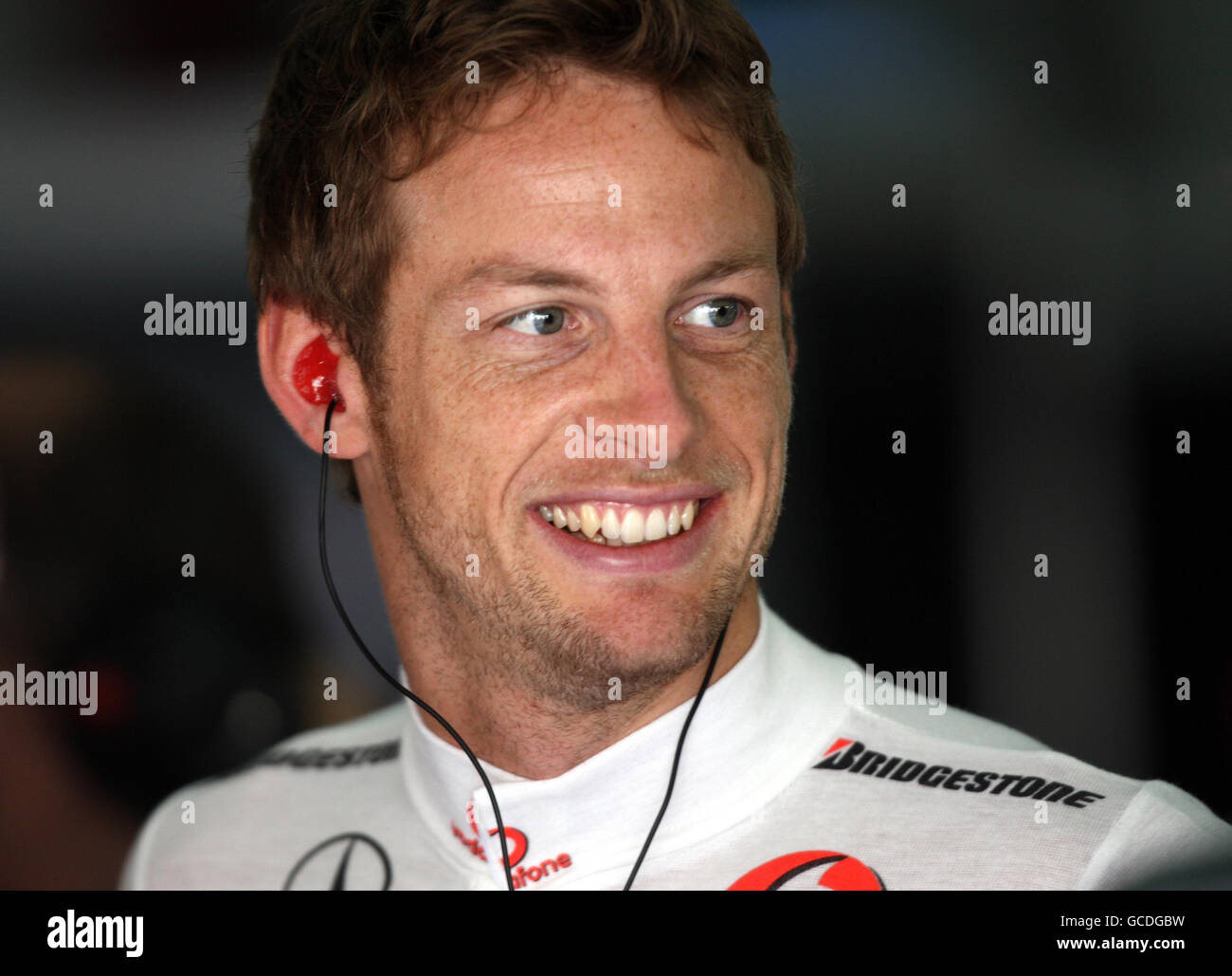 McLaren driver Jenson Button in the garage during the Practice Session at the Bahrain International Circuit in Sakhir, Bahrain. Stock Photo