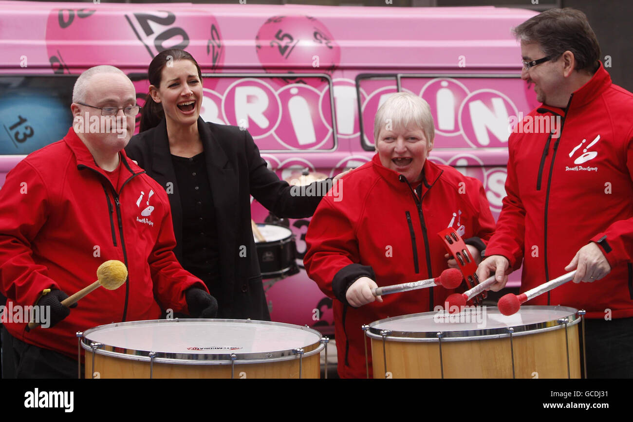Television presenter Kirsty Gallacher with members of Drumatik (names not known) during a photocall to open the National Lottery Britain Has Balls tour in St Enoch Square, Glasgow. Stock Photo