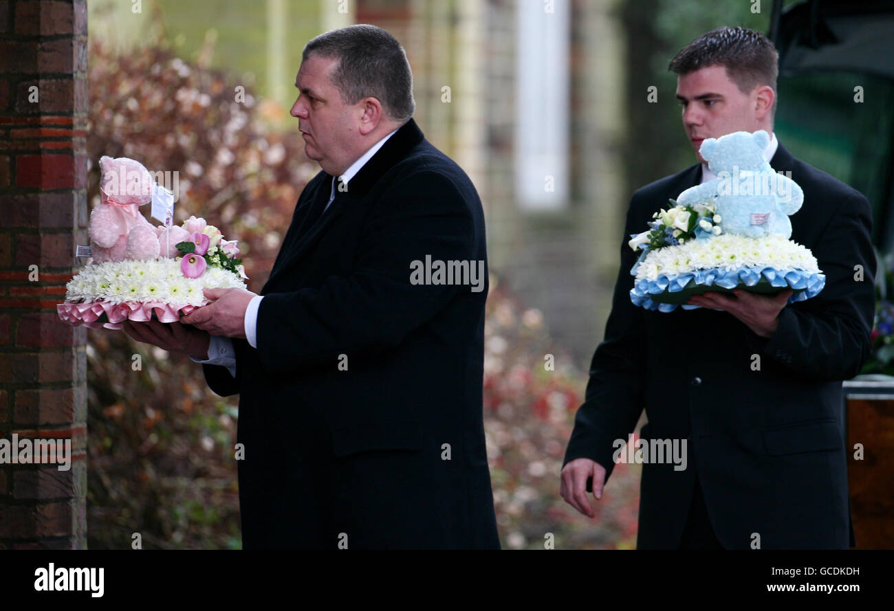 Flowers are taken into Mortlake Crematorium in Richmond, London, for