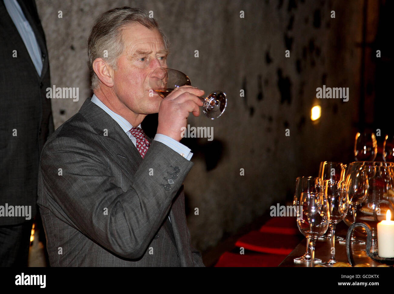 Prince of Wales tastes wine in a cellar as he visits the open air museum of Skanzen in Budapest, Hungary. Stock Photo