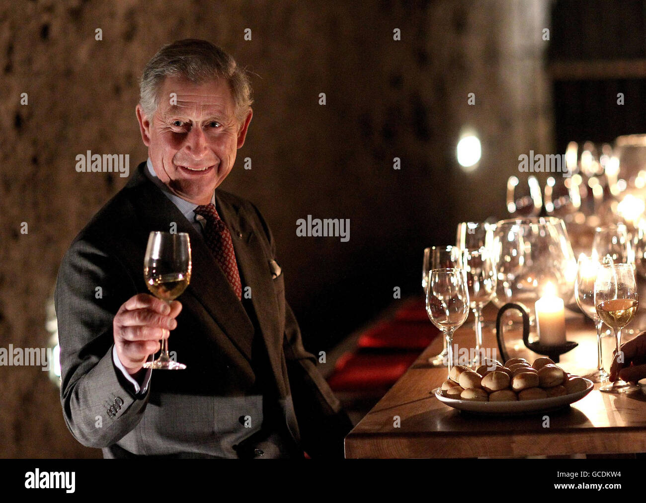 Prince of Wales tastes wine in a cellar as he visits the open air museum of Skanzen in Budapest, Hungary. Stock Photo