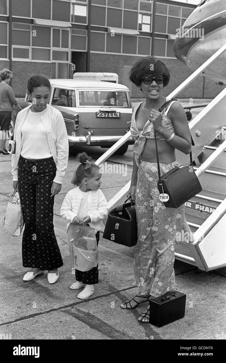 Singer Shirley Bassey in a floral Riviera two-piece, arrives with her children - Samantha, aged two-and-a-half and Sharon, who is nearly twelve - at London Airport today (Friday) from Nice. Stock Photo