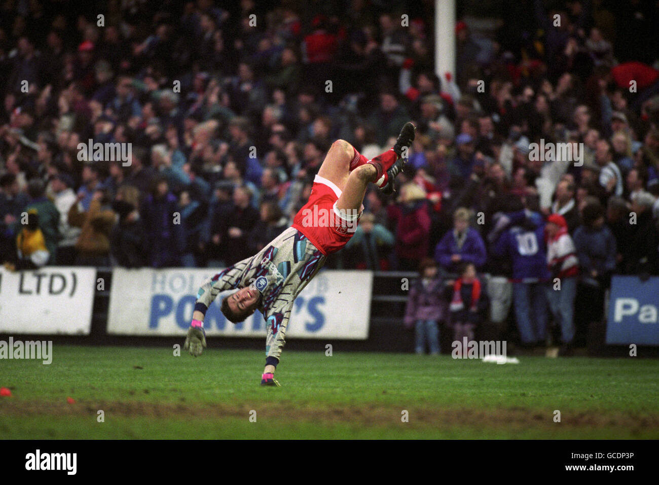 Nottingham Forest goalkeeper Mark Crossley celebrates by cartwheeling after his team had scored. Stock Photo