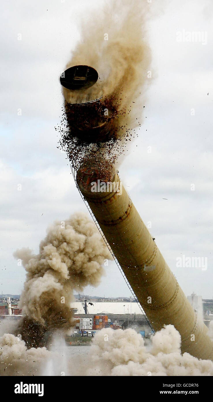 Two 550ft chimneys, which have dominated the Gravesham skyline for 40 years, come crashing down at Lafarge Cement's Northfleet site in Kent, marking the end of nearly 200 years of cement production at the site. Stock Photo