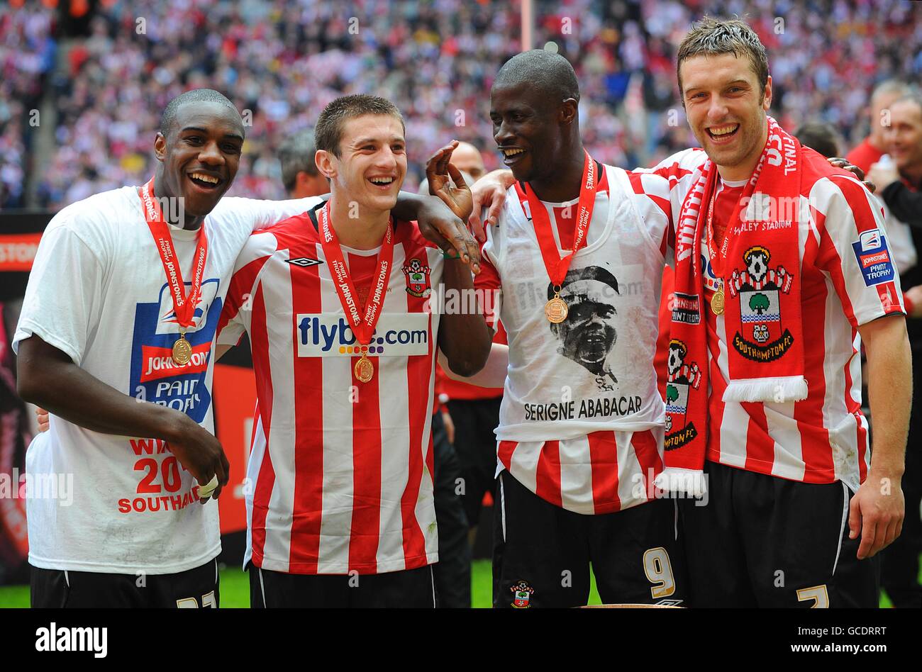 Southampton's goal scorers (L-R) Michail Antonio, Adam Lallana, Ndiaye Papa Waigo and Rickie Lambert celebrate after the final whistle. Stock Photo