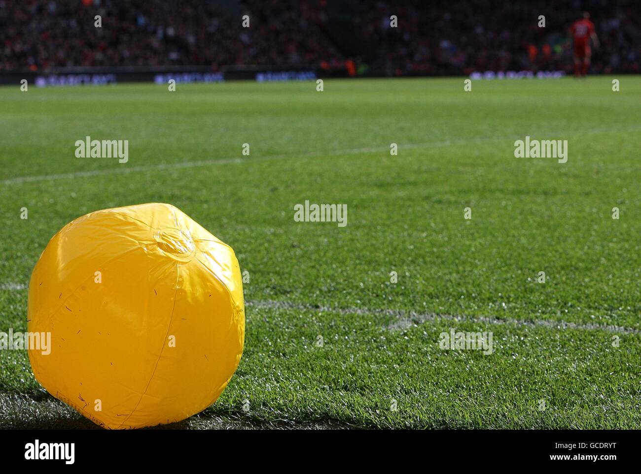 A beach ball on the pitch before kick off hires stock photography and