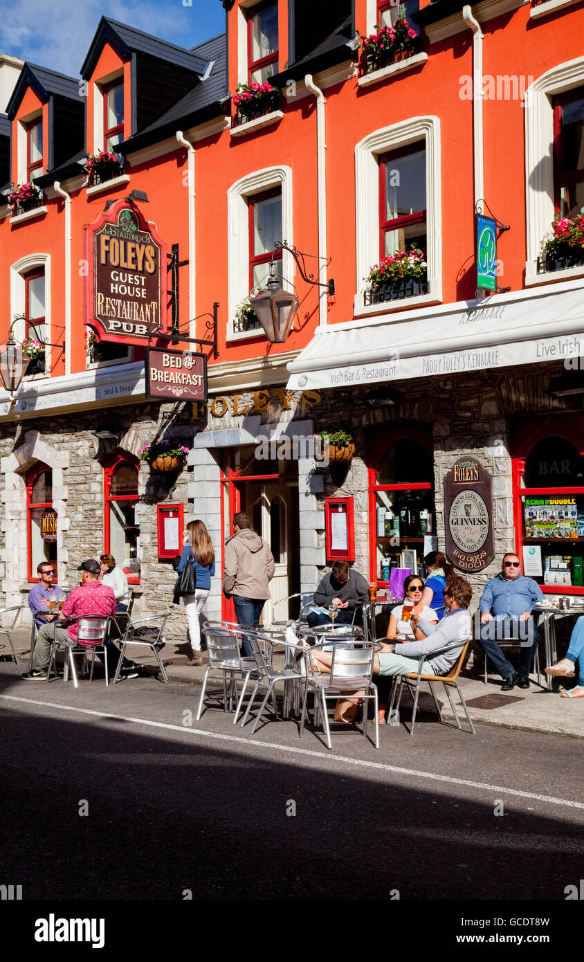 Customers sitting outside Foley's guest room, restaurant and pub; Kenmare, County Kerry, Ireland Stock Photo