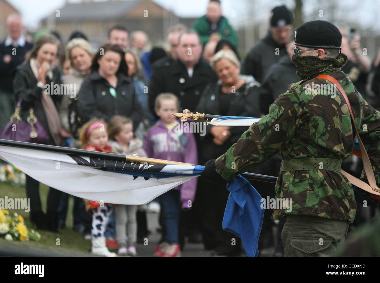 Masked members of the Real IRA at a Republican Easter commemoration ceremony at Creggan cemetery in Londonderry. Stock Photo