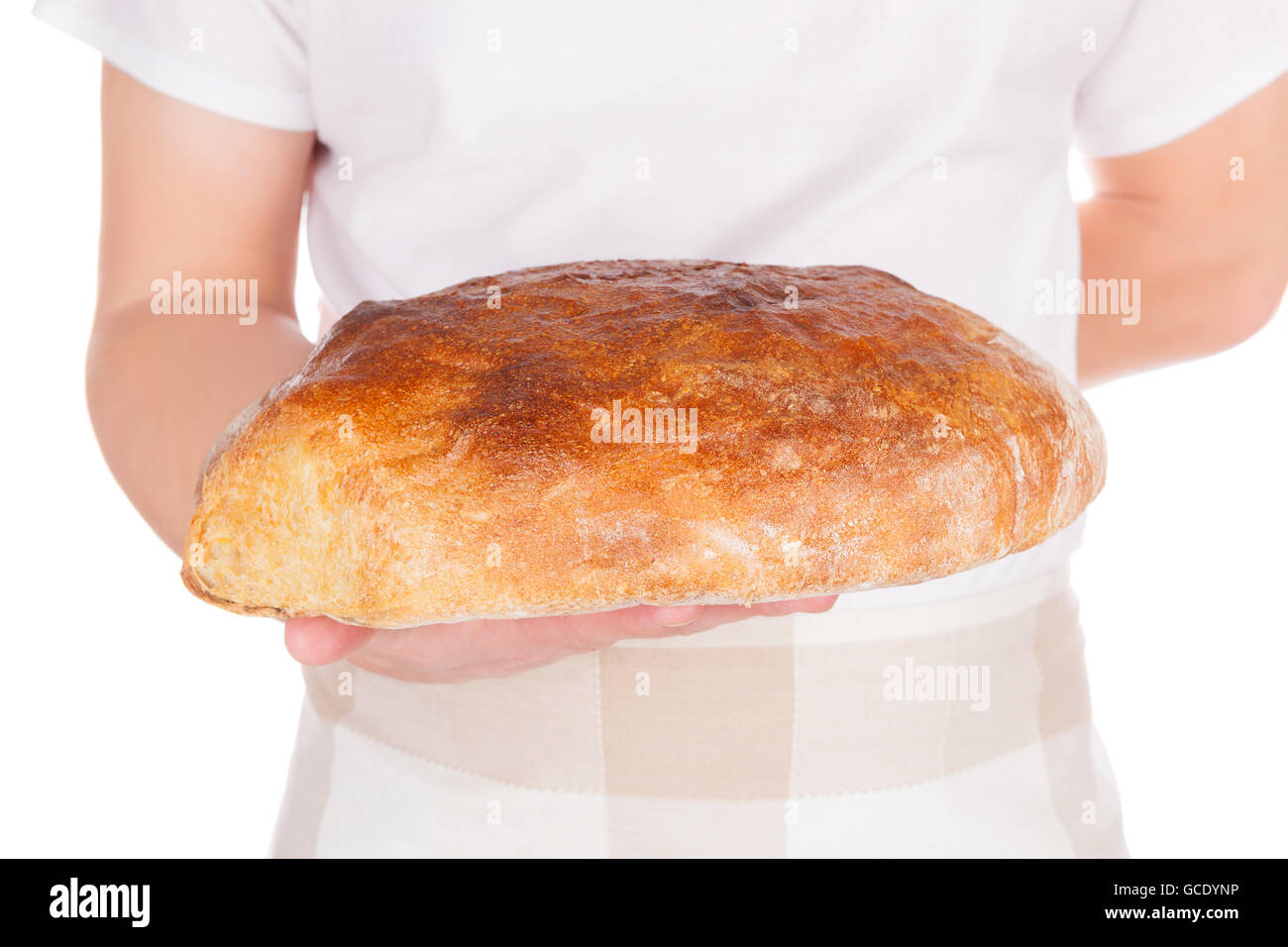 Baker holding fresh made bread isolated on white background. Baker and bakery. Stock Photo