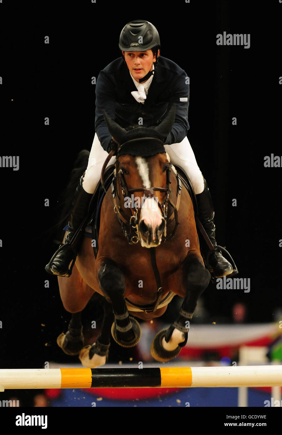 Fourth Place Ireland's Billy Twomey on Je T'aime Flamenco in tonight's final of the British Open Show Jumping Championships of the British Open Show Jumping Championships at the NEC, Birmingham. Stock Photo