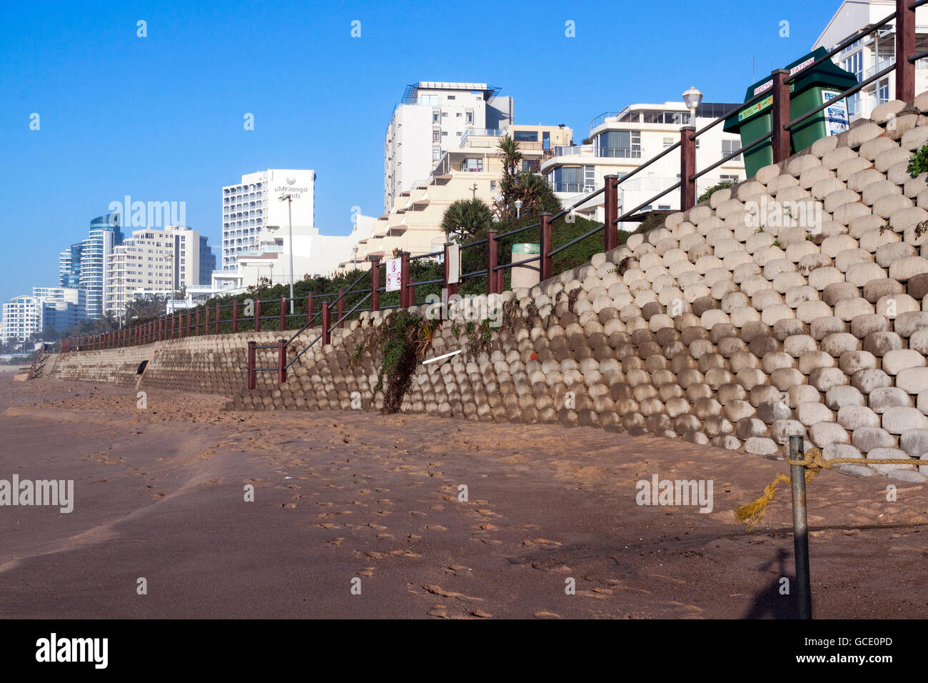 Empty beach and concrete retaining wall on early morning beach front