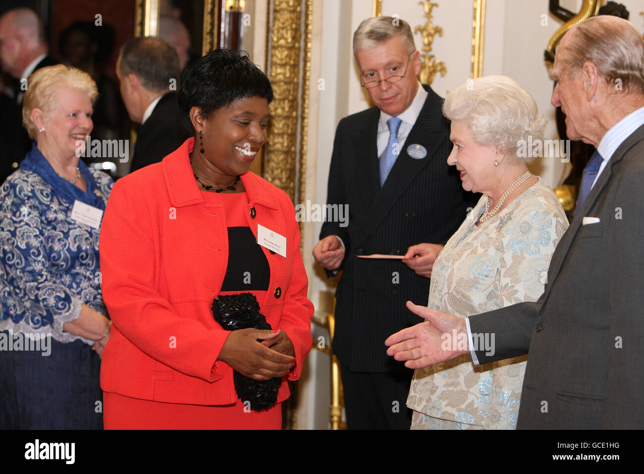 Queen Elizabeth II meets Sandra Hunt, manager of Clothing Solutions at