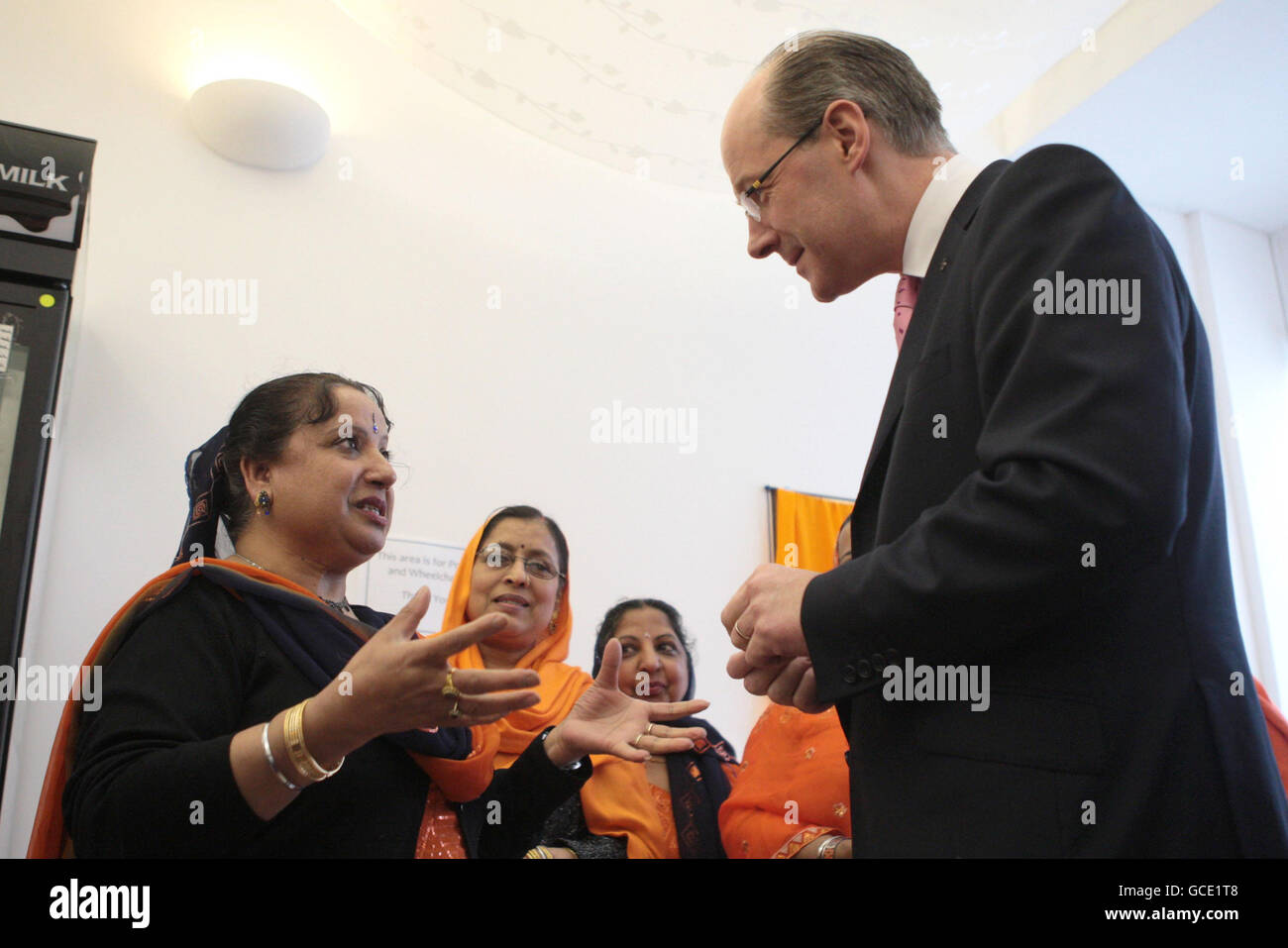 Finance Secretary John Swinney speaks with staff during a visit to Punjab'n de Rasoi, Edinburgh, as he attends the official opening of the new Sikh cafe which was set up with the help of Government funding. Stock Photo
