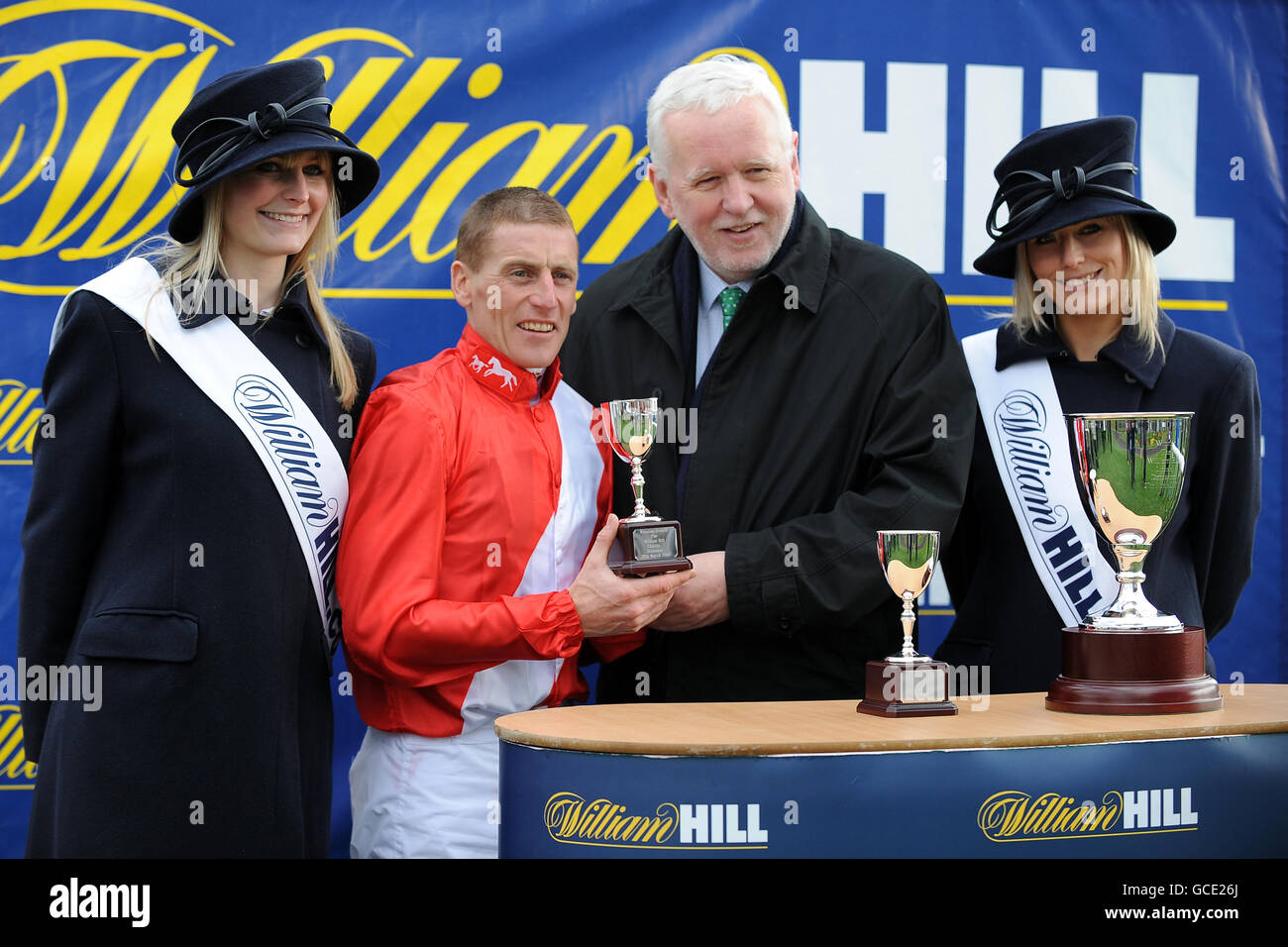 Jockey Johnny Murtagh (second left) celebrates winning the William Hill Lincoln on Penitent Stock Photo