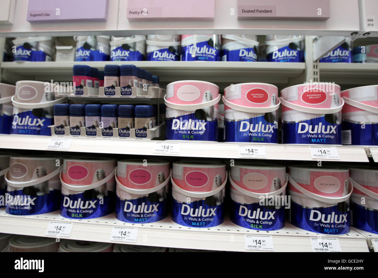 Tins of paint on sale at the B&Q store in Hayes, Middlesex Stock Photo
