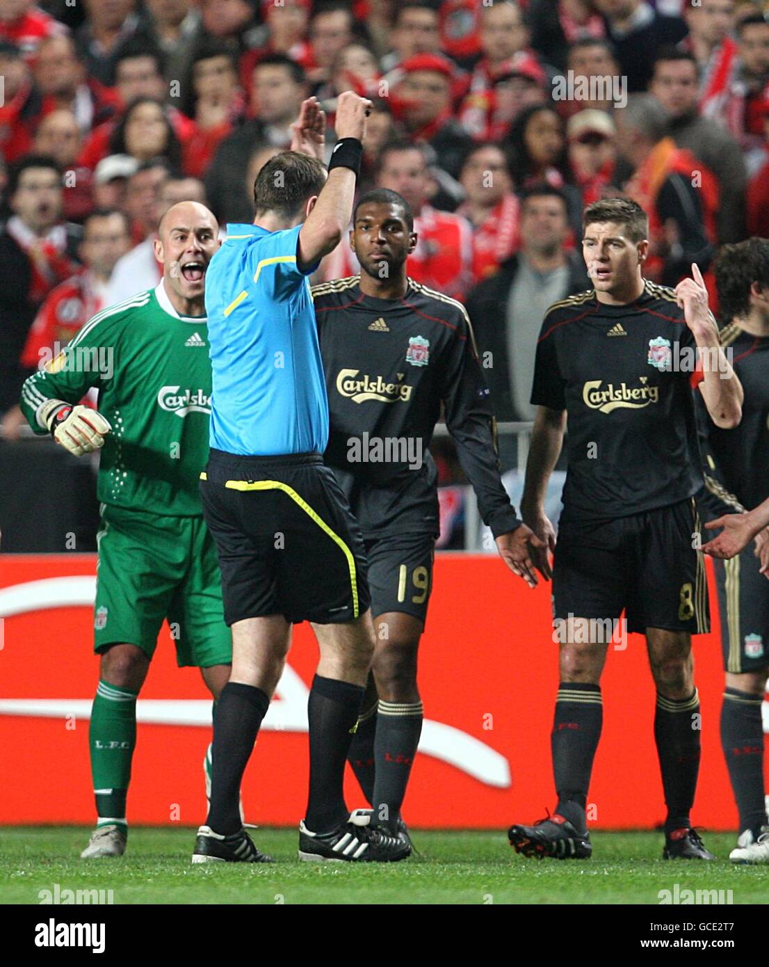 Liverpool's Jose Reina (left) and Steven Gerrard appeal to the referee Jonas Eriksson after Ryan Babel (centre) is sent off Stock Photo