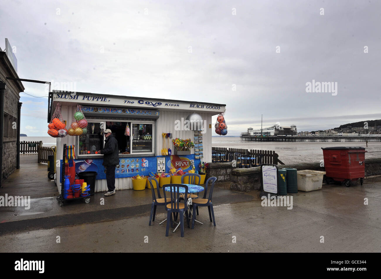 A man waits to be served at The Cove Kiosk on the promenade in Weston-super-Mare, Somerset. Stock Photo