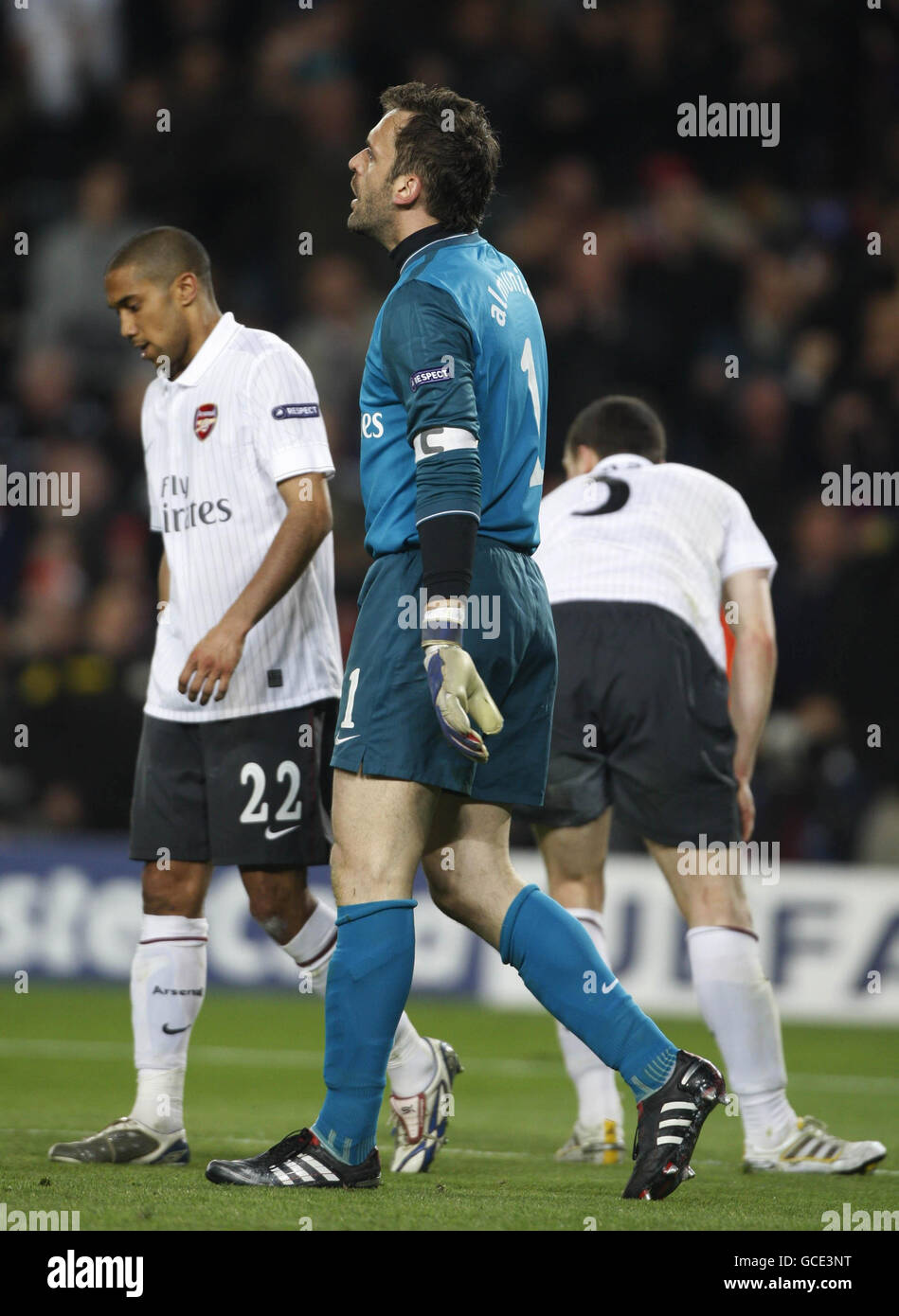 Arsenal's Manuel Almunia, Gael Clichy and Thomas Vermaelen show their dejection after Barcelona's Lionel Messi scores his third goal of the game during a Quarter Final Second Leg at the Nou Camp, Barcelona. Stock Photo