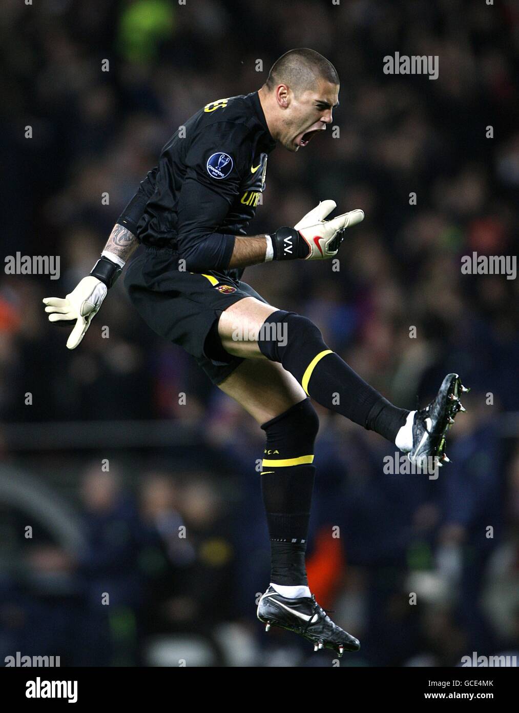 Barcelona goalkeeper Victor Valdes celebrates after team mate Lionel Messi (not pictured) scores their sides equalising goal of the game Stock Photo