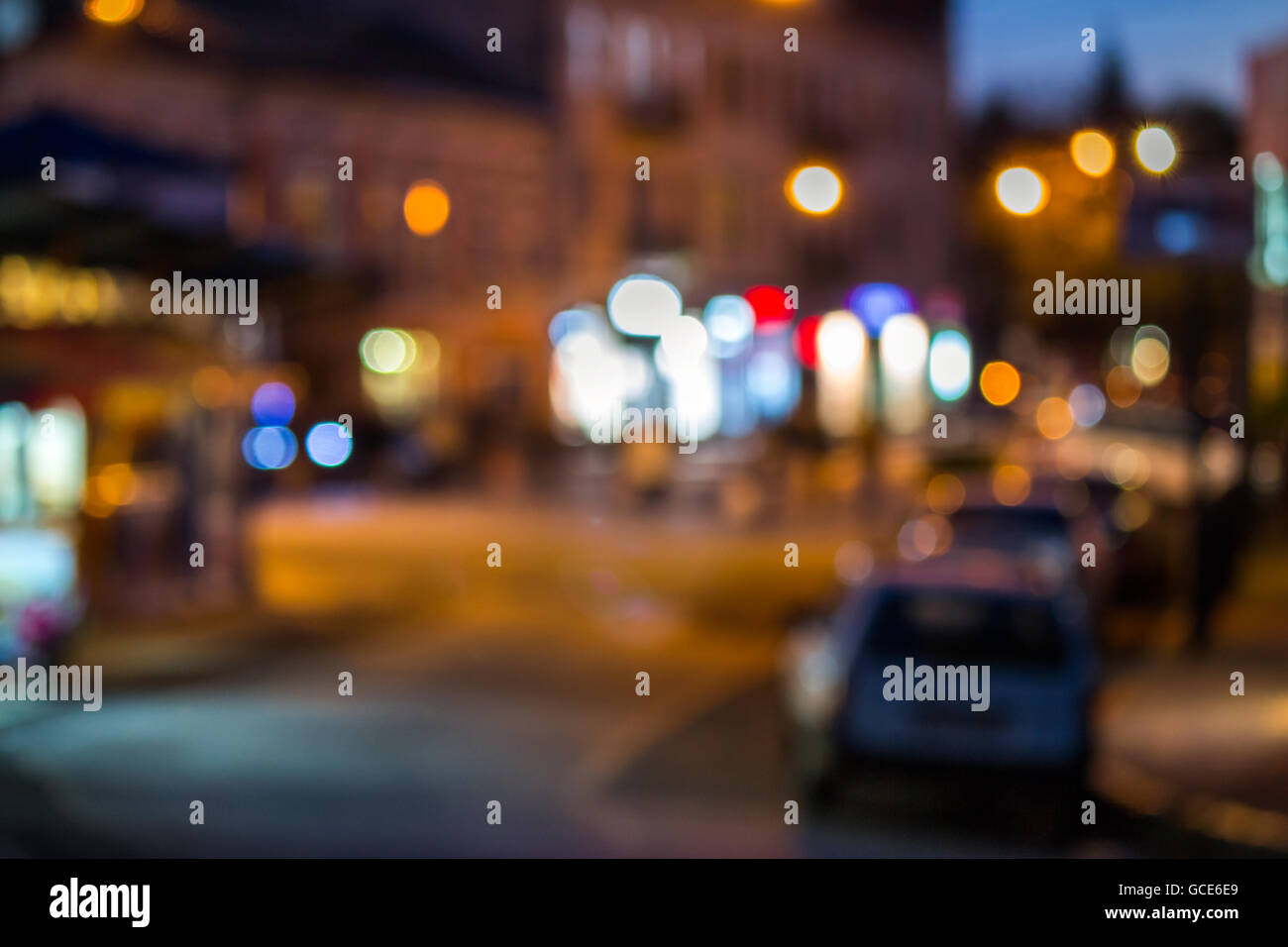 abstract blur of old city street with shops at night Stock Photo - Alamy