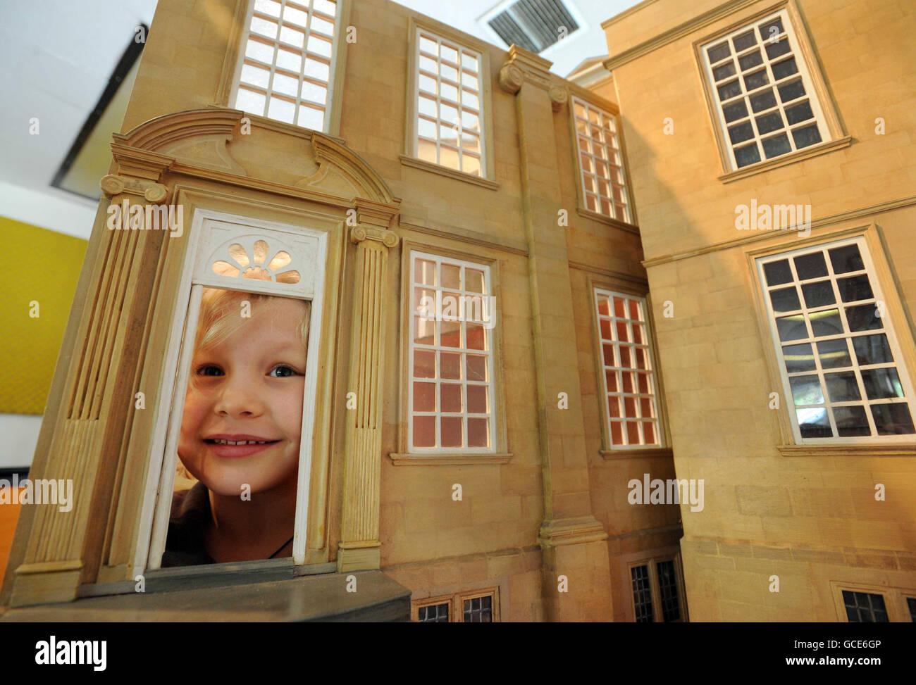 Emilia Hampton, who celebrated her 6th birthday today, with a 1:12th scale doll's house, modelled on Bourton House. The 24-room doll's house, which replicates the lavish interior of the celebrated country manor, is expected to fetch up to 3,000 at auction. Stock Photo